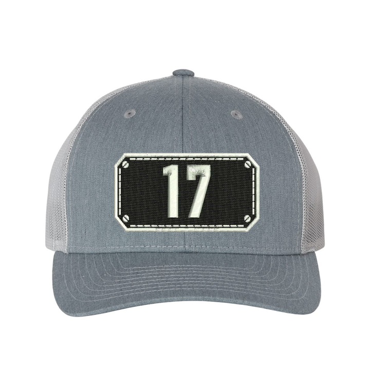 Richardson Trucker Hat.  Black Shield design with your fire station number embroidered in the shield.  Hat color heather grey/light grey.