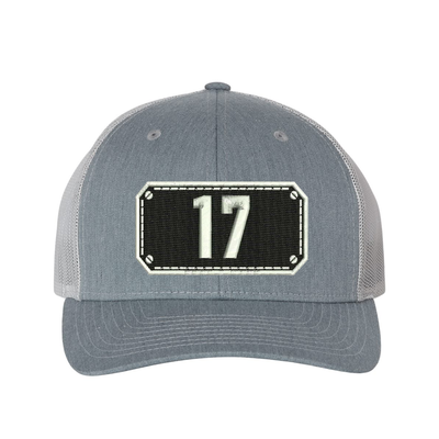 Richardson Trucker Hat.  Black Shield design with your fire station number embroidered in the shield.  Hat color heather grey/light grey.
