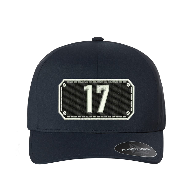 Black Shield design on a Delta Flexfit hat with your fire station number embroidered in the shield.  Hat color navy.