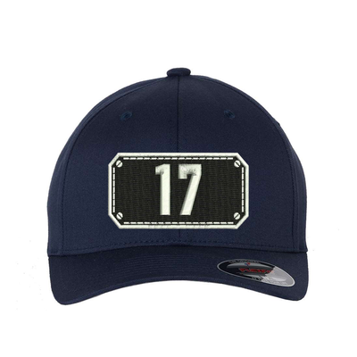 Black Shield design on a Flexfit hat with your fire station number embroidered in the shield.  Hat color navy.