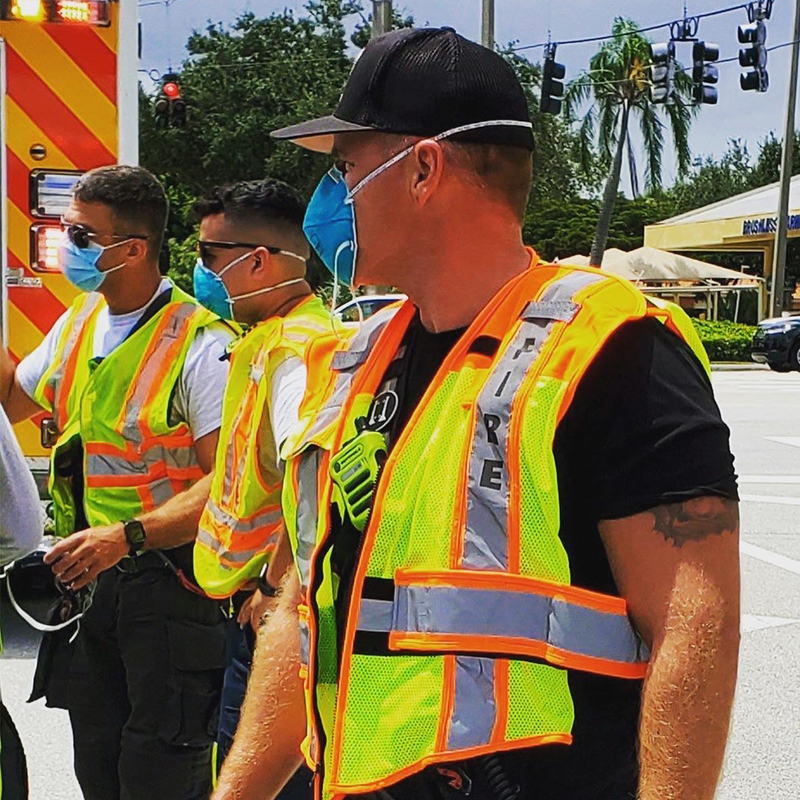 Firefighters on Scene Wearing FIRE UltraBright Orange 6-Point Breakaway Public Safety Vest